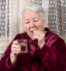 Old woman going to take the medicine