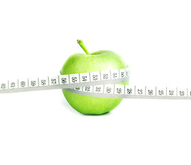 green apple with Measuring tape in concept of diet