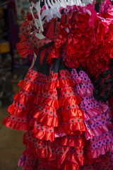 Spanish dresses for sale on a stand