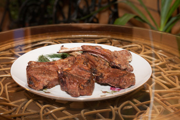 Tasty ribs on the plate