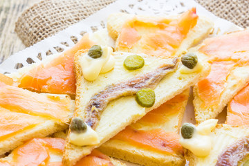 Canapes with anchovy and capers