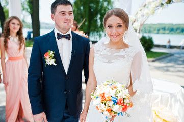 happy fashionable wedding couple on wedding ceremony of registra