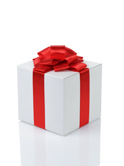 white paper gift box with red ribbon bow isolated