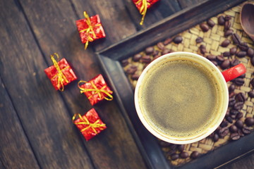 Coffee cup and christmas decoration on wooden table background
