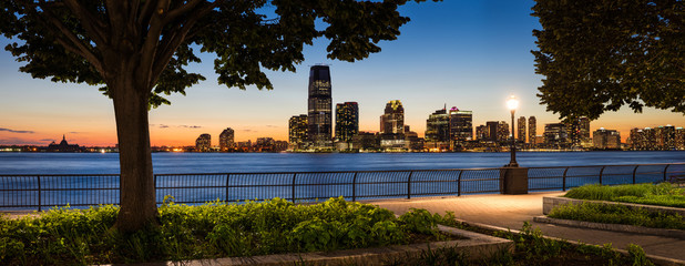 Jersey City Waterfront with Hudson River from Manhattan at Sunse - obrazy, fototapety, plakaty