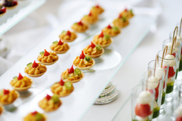 Plates with assorted snacks on an event party