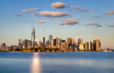 Skyline of New York City, Lower Manhattan. Ellis Island appears in front of the Financial...