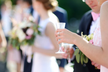 Woman holding a glass of champagne