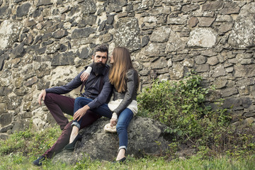Couple near stony wall