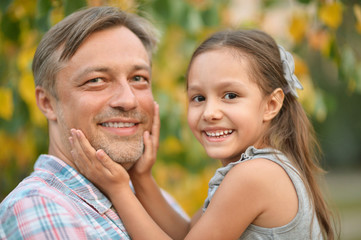 Fototapeta premium father with daughter in summer park