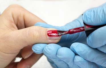 woman doing manicure beauty salon varnish wellness