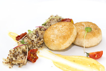 chicken cutlet with quinoa porridge on a table in a restaurant