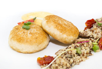 chicken cutlet with quinoa porridge on a table in a restaurant