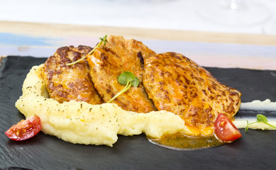 cutlets fried in carrot sauce with mashed potatoes