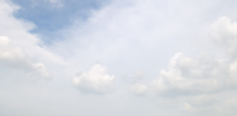 white clouds on a blue sky background