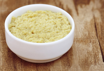 Crushed ginger in a white bowl