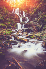 View of a beautiful autumn waterfall in mountains. © vovik_mar