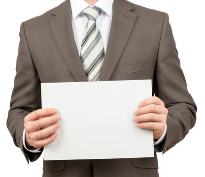 Businessman with blank paper in hands
