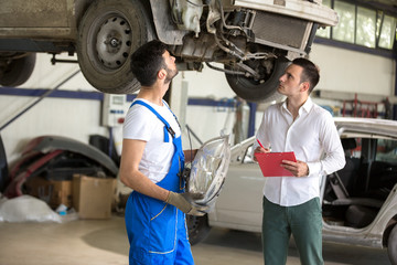 assessor and repair man talking