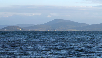 View of the sea and the hills on the opposite shore of the bay