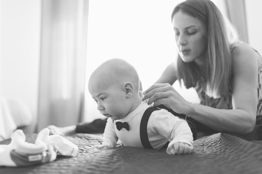 Mother Dressing Baby Boy