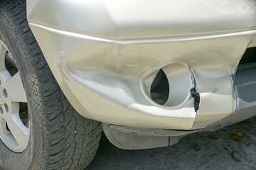 A dent on the right front of a pickup truck (damage from crash accident)