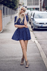 Lovely young girl in posing outdoors