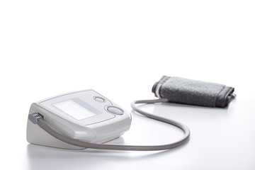 Digital Blood Pressure Monitor closeup on white