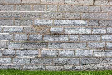 Hintergrund –Natursteinmauermit eckigen Steinen