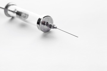 Old glass multiple use syringe with needle