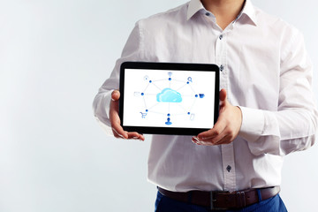 Businessman with  cloud computing diagram on tablet-pc, modern technology concept