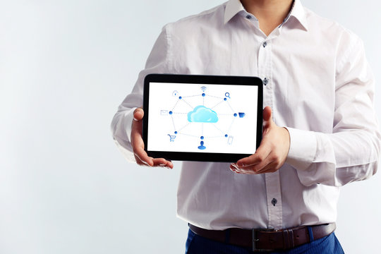 Businessman with  cloud computing diagram on tablet-pc, modern technology concept