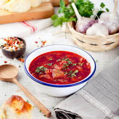 Traditional Ukrainian Russian vegetable soup, borsch with garlic donuts, pampushki.