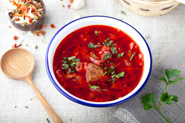Traditional Ukrainian Russian vegetable soup, borsch with garlic donuts, pampushki.