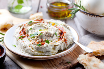 Traditional arabian eggplant dip baba ganoush with herbs, smoked paprika