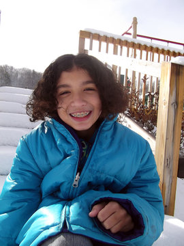 Blue Coat Braces Vertical/Close Up Of Child With Braces Wearing Big Puffy Coat.