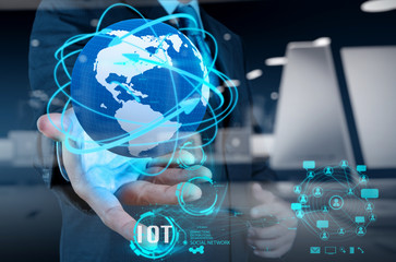 double exposure of hand showing Internet of things (IoT) word di
