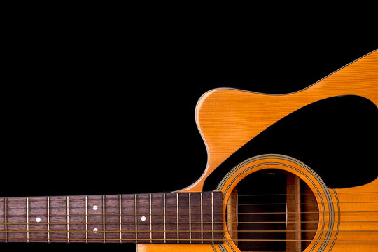 acoustic guitar detail on black background
