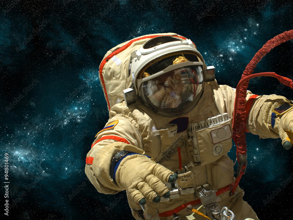 Wall mural a cosmonaut floats in deep space - elements of this image furnished by nasa.