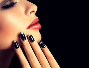  Beautiful model brunette shows black and silver French manicure on nails. Luxury fashion style, manicure nail , cosmetics and makeup .   © edwardderule