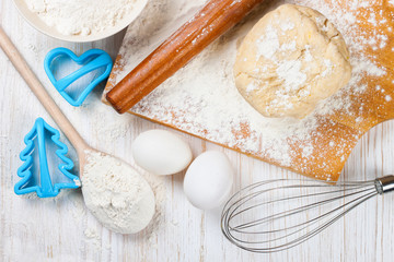 Baking ingredients on white wooden background