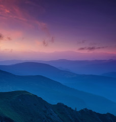 Fototapeta premium Hills lines in mountain valley during sunset. Natural summer mountain landscape