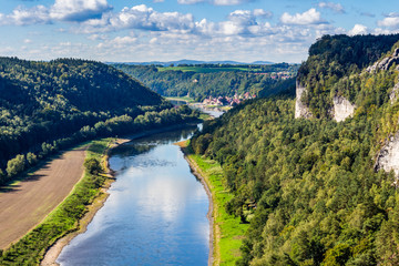 Fototapeta na wymiar View from viewpoint of Bastei in Saxon Switzerland Germany to the town city and the river Elbe on a sunny day in autumn