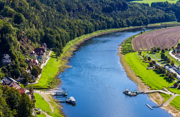 View from viewpoint of Bastei in Saxon Switzerland Germany to the town city and the river Elbe on a...