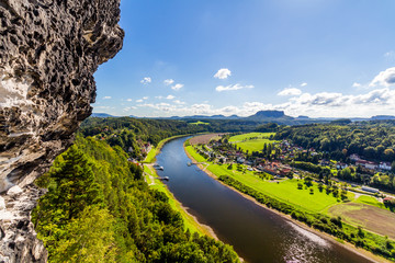 View from viewpoint of Bastei in Saxon Switzerland Germany to the town city and the river Elbe on a sunny day in autumn