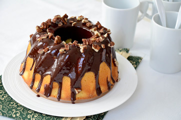 Bundt cake with chocolate glaze and pecan