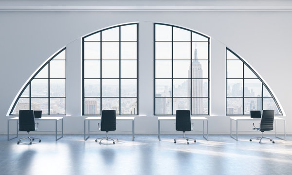 Workplaces in a bright modern open space loft office. White tables and black chairs. New York city view. 3D rendering.