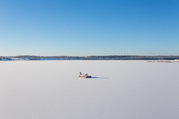 Frozen lake with ice and snow