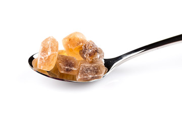 brown caramelized sugar in a wooden spoon