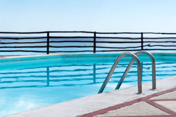 Grab bars ladder in swimming pool
